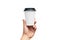 Isolated Takeaway cup, for Coffee, Tea in a guy s hand with a black cap. on a white background