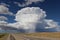 Isolated thunderstorm along desert highway