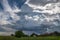 Isolated thunderstorm cloud over a scenic romanian village