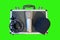Isolated top view of a box with a condenser microphone set on top of it, on green background