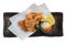 Isolated top view of Japanese deep fried Chicken Karaage with cooking paper served with tempura sauce Tentsuyu.