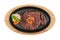 Isolated top view of medium rare wagyu steak topping with mince carrot on hot plate wooden plate served with potato salad.