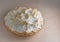 Isolated traditional holiday dessert of coconut meringue pie on