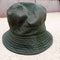 Isolated used green bucket hat