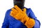 Isolated welder in orange glove and mask standing