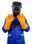 Isolated welder in orange gloves and mask standing