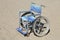 isolated wheelchair made of aluminum on beach sand