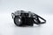 Isolated white background Beautiful vintage analog rangefinder film camera. 70`s Decade film camera. Front left view image