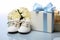 Isolated white composition babys bootees, blank postcard, and a pacifier, perfect gifts