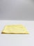 Isolated white yellow eyeglass lens cleaning cloth