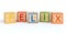 Isolated wooden toy cubes with letters with name felix