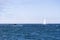 Isolated yacht sailing in the blue Atlantic Ocean near Monterey, California