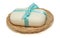isolation photo of soap with a bow in a basket on a white background