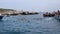 Isole Tremiti â€“ Barche di turisti sopra la Statua di Padre Pio