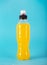 Isotonic energy drink. Bottle with yellow transparent liquid, sport beverage on a colorful background