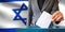 israel elections hand putting vote in ballot