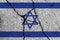 Israel flag on cracked concrete wall. The concept of crisis, default, economic collapse, pandemic, conflict, terrorism