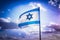 Israel flag waving cloudy sky background sunset