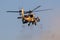 Israeli Air Force AH-64 Apache combat helicopter firing guns during an airshow at Hatzerim, Israel