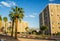 Israeli city street of the most south town Eilat walk way alley with palms and living buildings in summer time bight clear weather