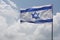Israeli flag on background of cloudscape