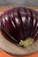 Israeli Huge Baladi Big ripe whole raw violet eggplant on table