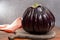 Israeli Huge Baladi Big ripe whole raw violet eggplant on table