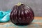 Israeli Huge Baladi Big ripe whole raw violet eggplant on table