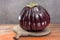 Israeli Huge Baladi Big ripe whole raw violet eggplant on table