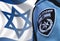 Israeli police officer on the Israeli flag bokeh background