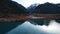 Issyk mountain lake with mirror water at sunset.