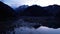 Issyk mountain lake with mirror water at sunset.