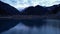 Issyk mountain lake with mirror water at sunset.