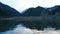 Issyk mountain lake with mirror water at sunset.