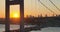 Istanbul Bosphorus Bridge and City Skyline in Background with Turkish Flag at Beautiful Sunset, Aerial slide orbiting