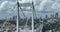 Istanbul Bosphorus Bridge and City Skyline in Background with Turkish Flag at Beautiful Sunset, Aerial slide orbiting