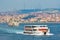 Istanbul cityscape, passenger ferries cross strait of Bosphorus.