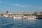 Istanbul cityscape, waterfront panorama from the Bosphorus with sightseeing boats, tourist attraction