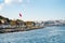 Istanbul embankment. The mouth of the Golden Horn Bay. Turkey flag. Istanbul. Turkey - 09.25.2021