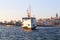 Istanbul, Fatih Eminonu / Turkey - September 14 2019: A big boat rising in Eminonu and Galata tower in the back.