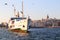 Istanbul, Fatih Eminonu / Turkey - September 14 2019: A big boat rising in Eminonu and Galata tower in the back.