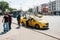 Istanbul, June 11, 2017: A traditional yellow taxi on the street in the Fatih district of Istanbul, Turkey. Customers