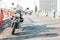 Istanbul, June 15, 2017: Front view of motorcycle on Galata Bridge. Angler fishing and pedestrians walking on the