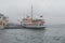 Istanbul, Kadikoy. Foggy morning, waiting to ferry passengers an