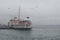 Istanbul, Kadikoy. Foggy morning, waiting to ferry passengers an