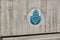 Istanbul municipality logo engraved with blue on concrete wall in Kadikoy shore istanbul.