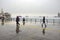 Istanbul steamboat pier people walking in the rain.