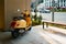 ISTANBUL, TURKEY - APRIL 12, 2022: Yellow moped parked in Istanbul street