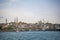 Istanbul, Turkey - April 2022: Famous Suleymaniye Mosque, boats and Bosporus Channel