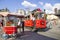 Istanbul, Turkey - August 05, 2019: The nostalgic tram beside a cart selling traditional Turkish simit